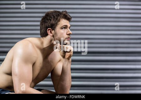 Thoughtful man looking up Stock Photo