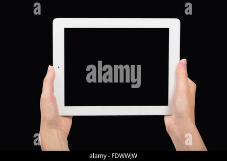 Digital Tablet and Hands on Black Background Stock Photo