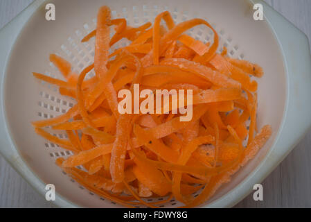 carrot peelings in a colander Stock Photo