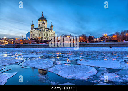 Floe on the Moscow River with Christ the Savior Cathedral on background on a winter evening, Moscow, Russia Stock Photo