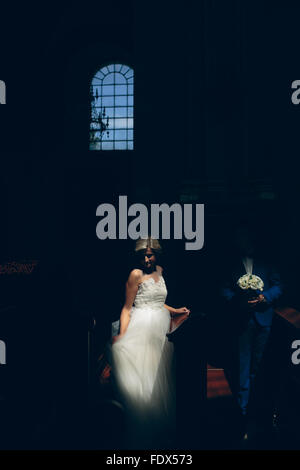 bride and groom illuminated by light Stock Photo