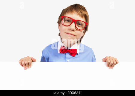 Image of confused boy holding white square. Place for advertisement Stock Photo