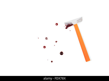 Studio shot of a shaver and blood on white background Stock Photo