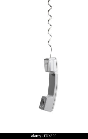 Studio shot of a hanging telephone receiver Stock Photo