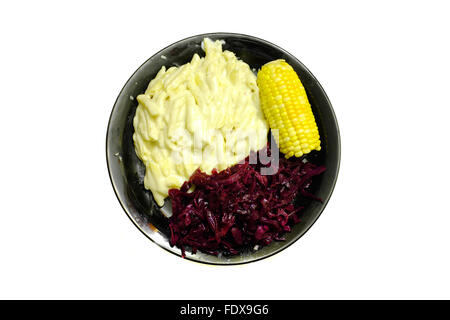 A plate of macaroni cheese and vegetables on a black plate photographed against a white background Stock Photo
