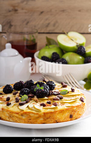 Baked homemade cottage cheese casserole or pudding with raisins serving ...