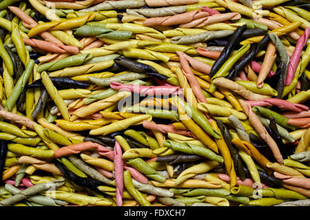 Background of raw colorful pasta of different colors Stock Photo
