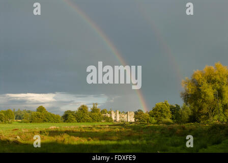 Cowdray Ruins, Midhurst, West Sussex, UK. Under a rainbow. View down the causeway. September. Stock Photo