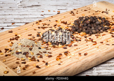 Variety of hot pepper on wood board Stock Photo