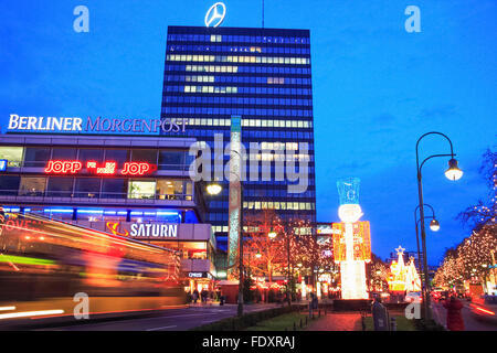 Europa-Center building complex and traffic trails in Breitscheidplatz, Berlin, Germany Stock Photo