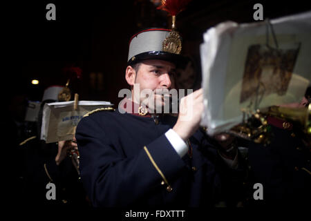 A musician plays the trumpet during an Easter Holy Week procession in Trujillo, Extremadura, Spain. Stock Photo