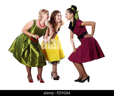 three stylish young woman in bright colour dresses Stock Photo