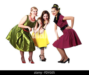 three stylish young woman in bright colour dresses Stock Photo