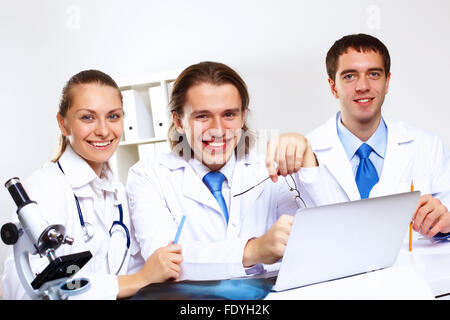 Doctors In Uniform Group of doctors in uniforms together in clinic Stock Photo - Alamy