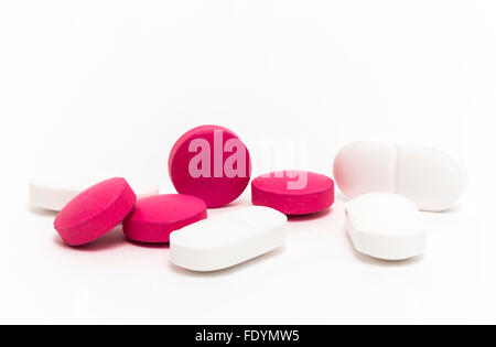 Pink and white pills isolated on white background Stock Photo