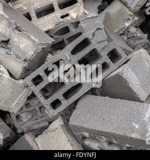 A mountain of concrete bricks arranged in bulk. Stock Photo