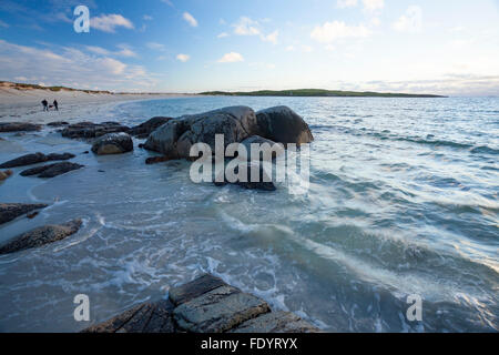 Couple on the beach at Dog's Bay, Connemara, County Galway, Ireland. Stock Photo