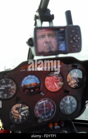 Beromuenster, Switzerland, helicopter pilot during a flight in the cockpit Stock Photo