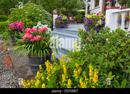 Vashon-Maury Island, WA: Colorful pots at the base of the steps to house and cottage garden Stock Photo