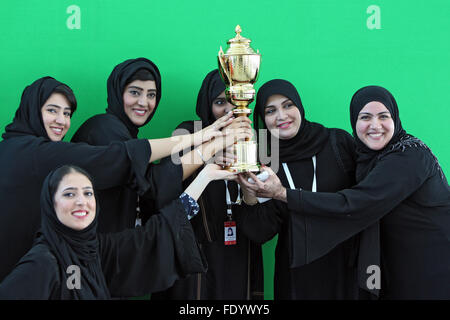 Dubai, United Arab Emirates, women in national costume holding a cup in the hands Stock Photo