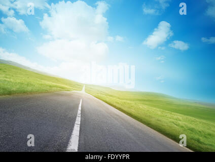 An open road through beautiful countryside. Stock Photo