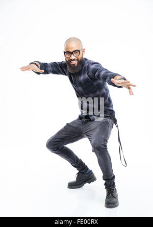 Happy african american young bearded man in glasses balancing and dancing Stock Photo