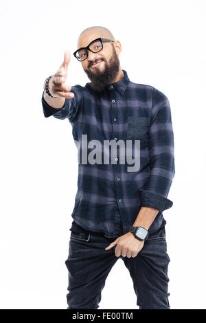 Smiling cool bearded african man in glasses standing and pointing to camera Stock Photo