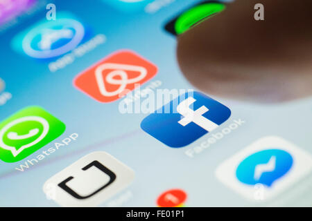Facebook social media app logo on screen of a  smart phone Stock Photo