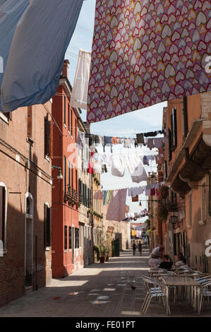 Arsenale, Washing Strung across Street above Cafe Stock Photo