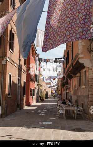 Arsenale, Washing Strung across Street above Cafe Stock Photo