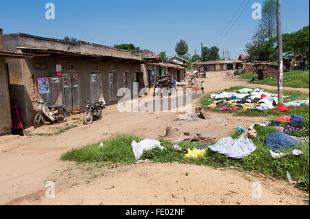 Typical village scene in Uganda, with washing drying on bushes. Stock Photo