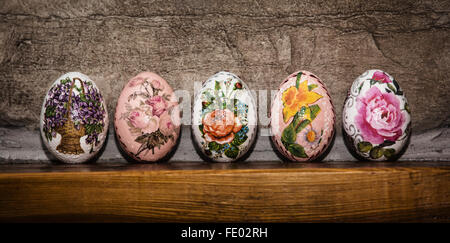 Colorful Easter eggs stacked on the wooden base. Easter holiday. Symbol of springtime. Stock Photo