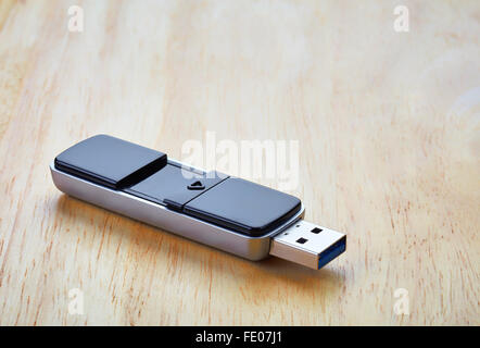 USB Flash memory on wooden table Stock Photo