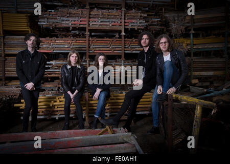 Stockport band Blossoms, pictured in a scaffolders' yard in the town. The guitar pop band have come fourth on the BBC Sound of 2016 list, which highlights the hottest new acts for the new year. The five members, who were all born in the same Stockport hospital, formed in 2013 and have honed their sound by rehearsing in their bassist's granddad's scaffolding yard take their name from a local pub. Stock Photo