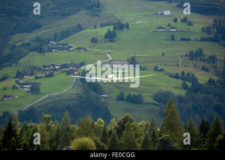 Aerial, Alps, motor glider Dimona H36 approaching Zell am See, General Aviatin, General Aviation, Sport Aircraft, Private Stock Photo