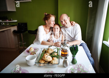 family preparing breakfast, morning tea Stock Photo