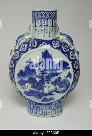 Antique Chinese blue and white porcelain moon flask painted with a figure on a bridge with mountains behind, the cylindrical nec Stock Photo