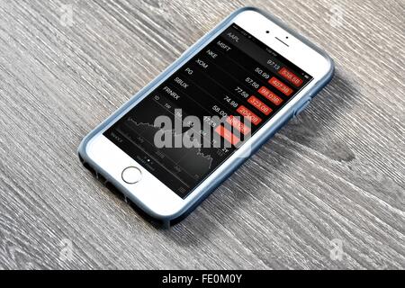 Apple iPhone displaying stock market on a day of market correction Stock Photo