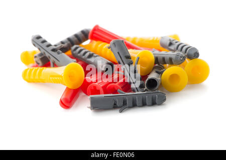 Closeup of colorful plastic dowels isolated on white background. Stock Photo