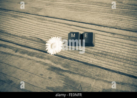 "me" wrote with keyboard keys on wooden background, black and white effect Stock Photo