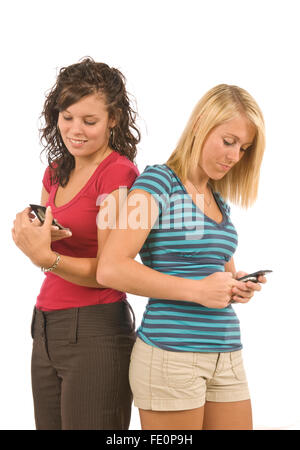 Female Teens Text Messaging Stock Photo