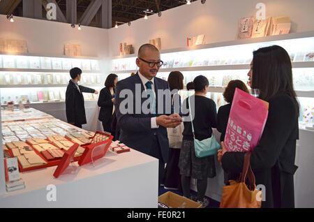 Tokyo, Japan. 3rd Feb, 2016. Hidenori Tanaka of Washiclub Co. Japan talks to an atendee during the 81st Tokyo International Gift Show Spring 2016. The show offers a collection of the latest smart phone goods, stationary, hobby material goods, exhibits of personal gifts, consumer goods and decorative accessories. The show also includes a new product contest in which more than 400 new products enter to compite. Also a collection of unique products from all over the world to compete in the most popular imported product contest. Kitchen and dining room goods contest. Established in 1976, TIGS is Stock Photo