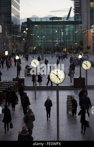 Public clocks outside Reuters Plaza in the heart of the financial district of Canary Wharf in the London Docklands, England, UK Stock Photo