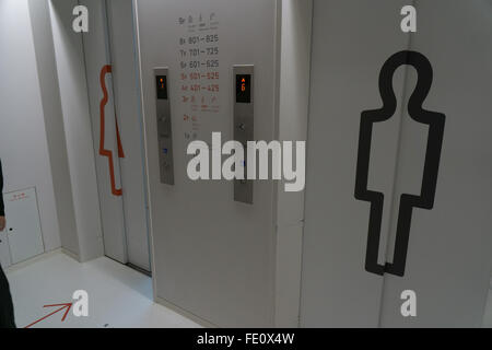 his and hers elevators in a capsule hotel Stock Photo