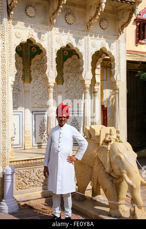 Indian guard standing at Rajendra Pol in Jaipur City Palace, Rajasthan, India. Palace was the seat of the Maharaja of Jaipur, th Stock Photo