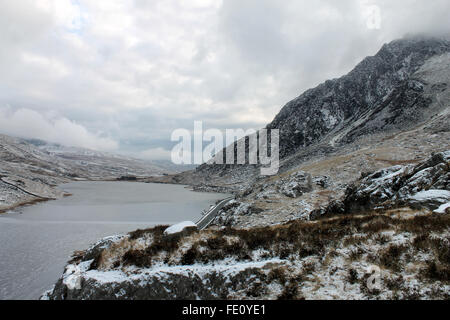 Frozen Ogwen lake and Tryfan mountain Wales Stock Photo