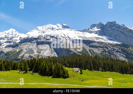 Amazing view of Swiss Alps and meadows near Oeschinensee (Oeschinen lake), on Bernese Oberland, Switzerland Stock Photo