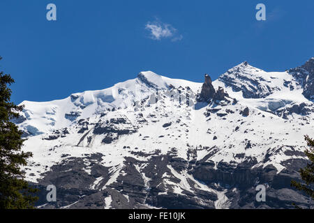 Ice-capped mountain rocks in Swiss Alps, Bernese Oberland, Switzerland Stock Photo