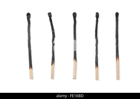 Studio shot of a row of burned wooden matchsticks on a white background Stock Photo
