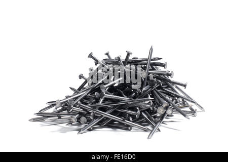 Studio Shot of a Pile of Construction Nails on a White Background Stock Photo